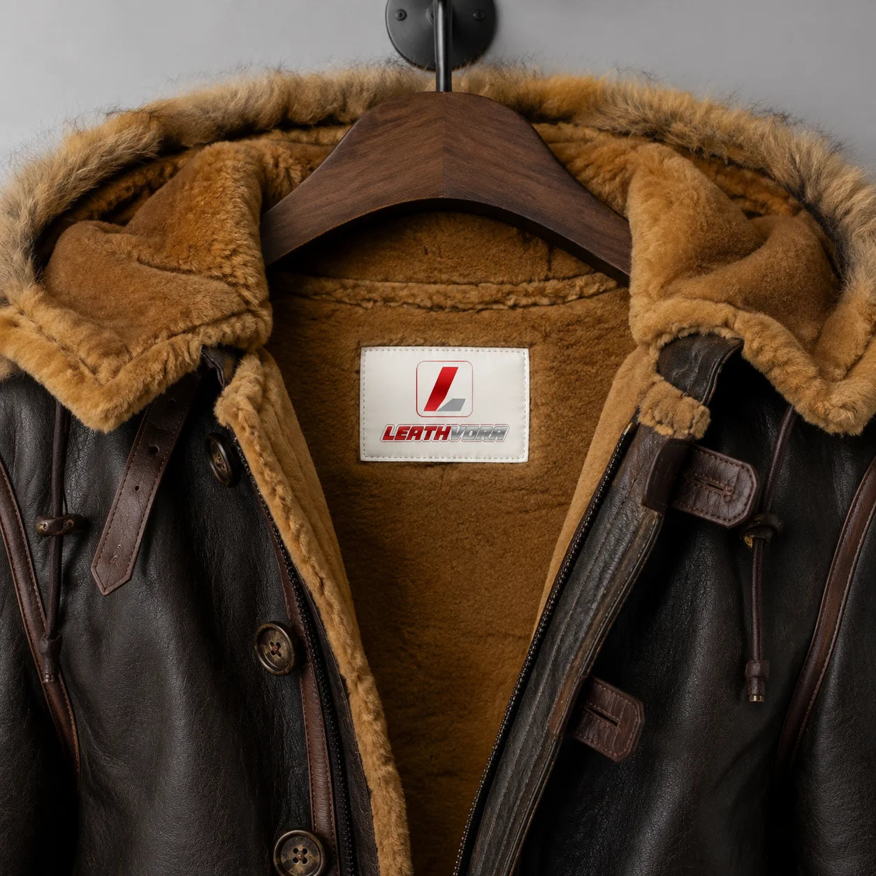Close-up of B7 flying parka shearling hood lining, leather trim and Leathvora interior branding detail