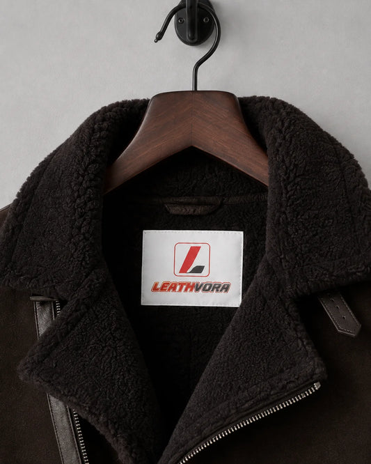 Close-up of black plush aviator collar and asymmetric zip with white Leathvora neck branding