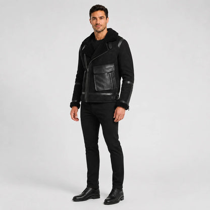 Three-quarter studio view of black aviator biker jacket with asymmetric zip and large utility flap pocket