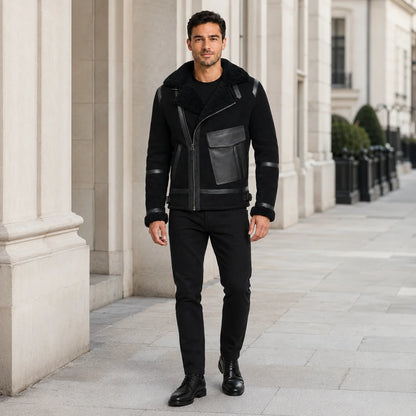 Man wearing black asymmetric aviator jacket with black trousers and boots in a refined urban setting