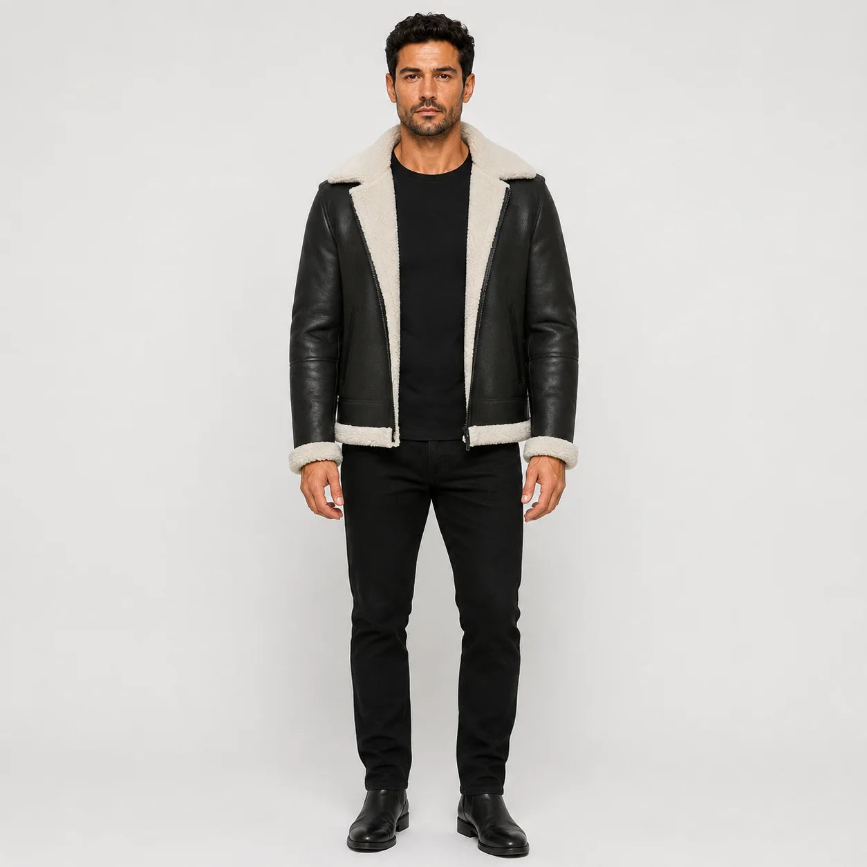 Front studio view of men’s black aviator jacket with white plush collar, cuffs, hem trim and open zip front
