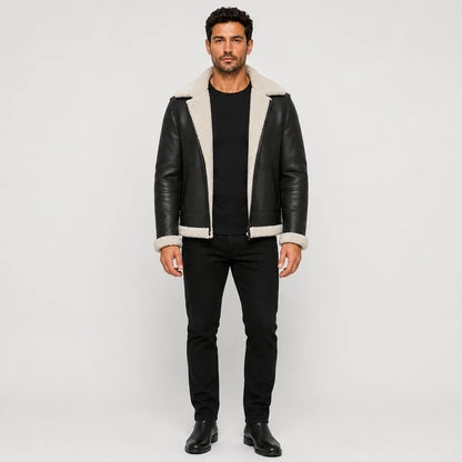 Front studio view of men’s black aviator jacket with white plush collar, cuffs, hem trim and open zip front