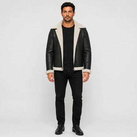 Front studio view of men’s black aviator jacket with white plush collar, cuffs, hem trim and open zip front