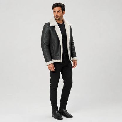 Three-quarter studio view of men’s black flight jacket highlighting white plush lapels, cuffs and side pocket