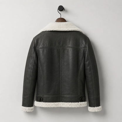 Hanging rear view of men’s black aviator jacket with white collar and hem trim plus adjustable rear waist buckles