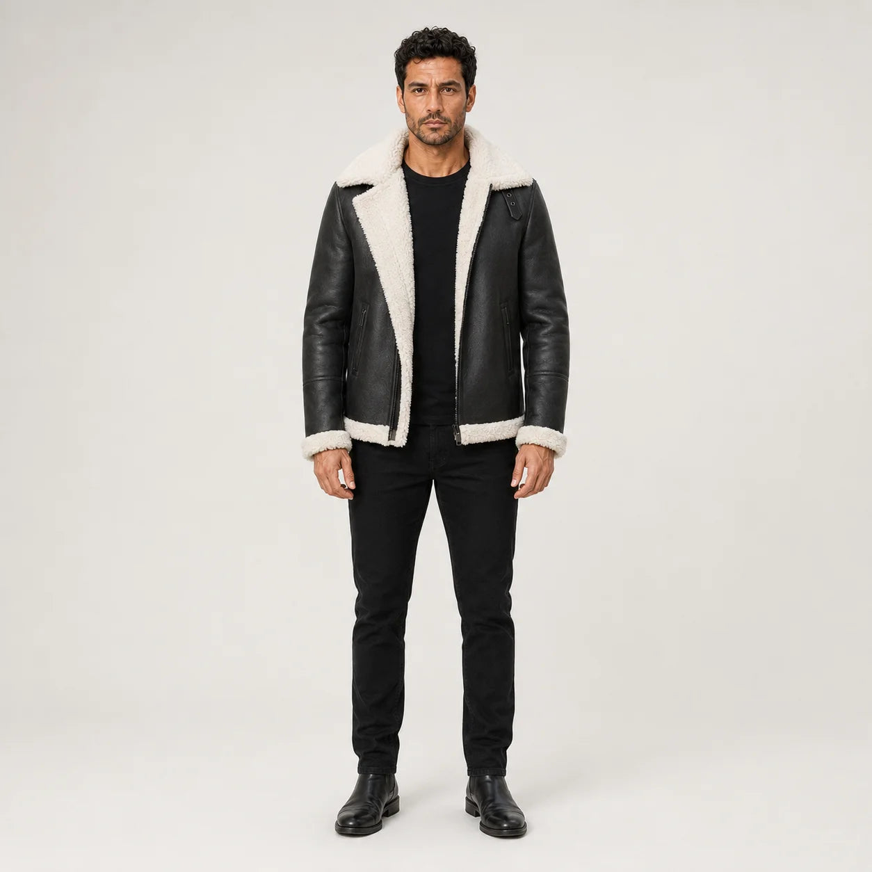 Straight-on model styling of black aviator bomber jacket with white contrast collar, cuffs and front trim