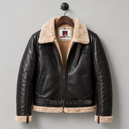Hanging front view of B3 leather bomber jacket with cream fur lining, angled pockets, waist buckle and zipped cuffs
