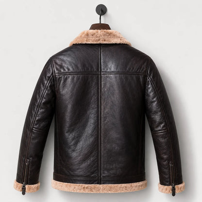 Hanging rear view showing dark leather back, centre seam, shoulder yoke, cream collar and fur-trimmed hem