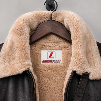 Close-up of cream plush aviator collar and lining with Leathvora neck label and dark textured leather exterior