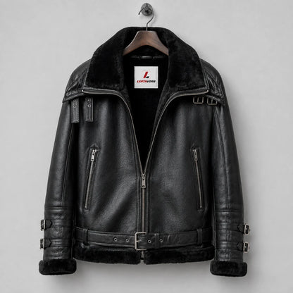 Hanging front view of black B3 aviator jacket displaying fleece collar, two zip pockets, waist belt and shoulder buckles