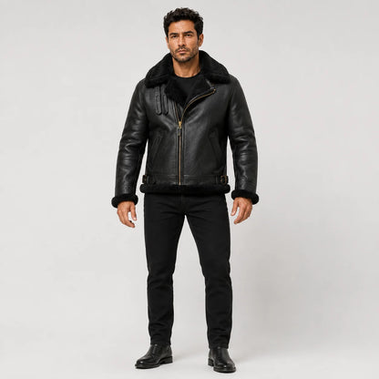 Front studio view of men’s black sheepskin aviator jacket with black shearling collar, cuffs and side buckle details