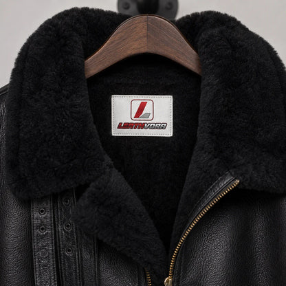 Close-up of black shearling collar and interior with Leathvora neck label, leather grain and front zip detail