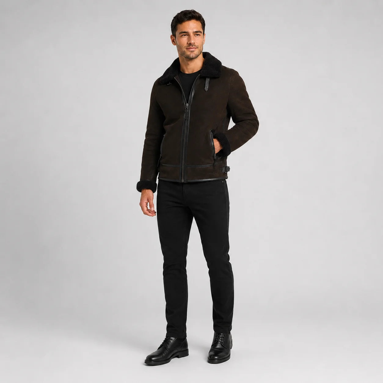 Three-quarter view of brown pilot jacket with centre zip, black collar, angled pockets and plush cuff edges