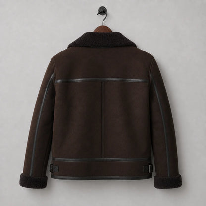 Hanging rear view of brown aviator jacket showing horizontal shoulder trim, central seam and buckle waist tabs