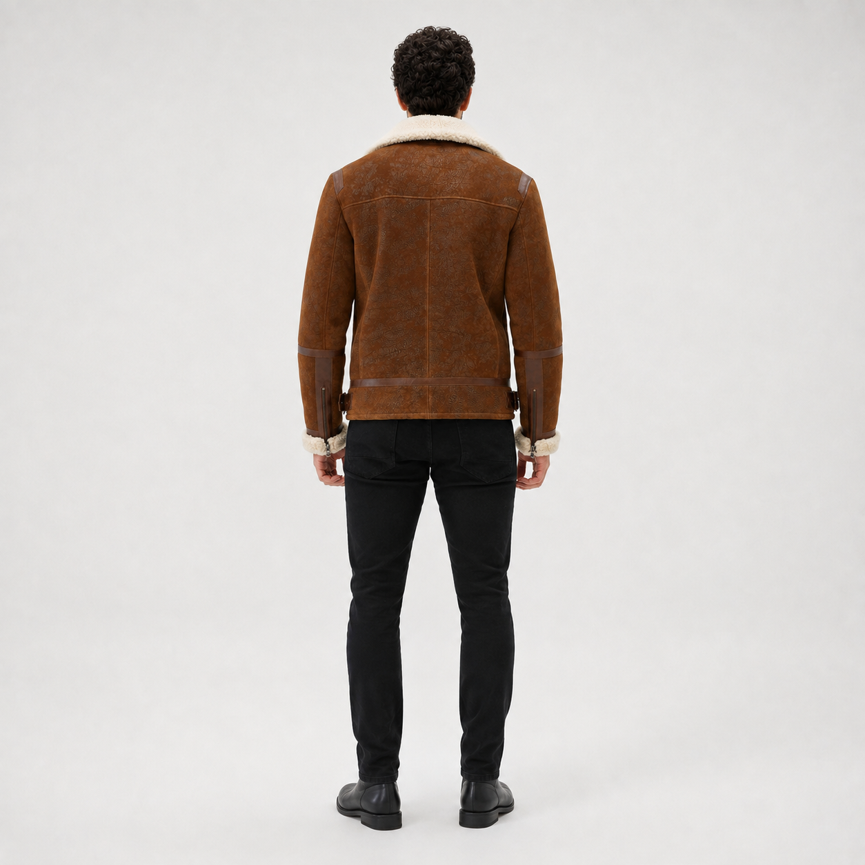 Rear model view of brown flight jacket showing cream collar, back yoke, centre seam and waist adjustment tabs