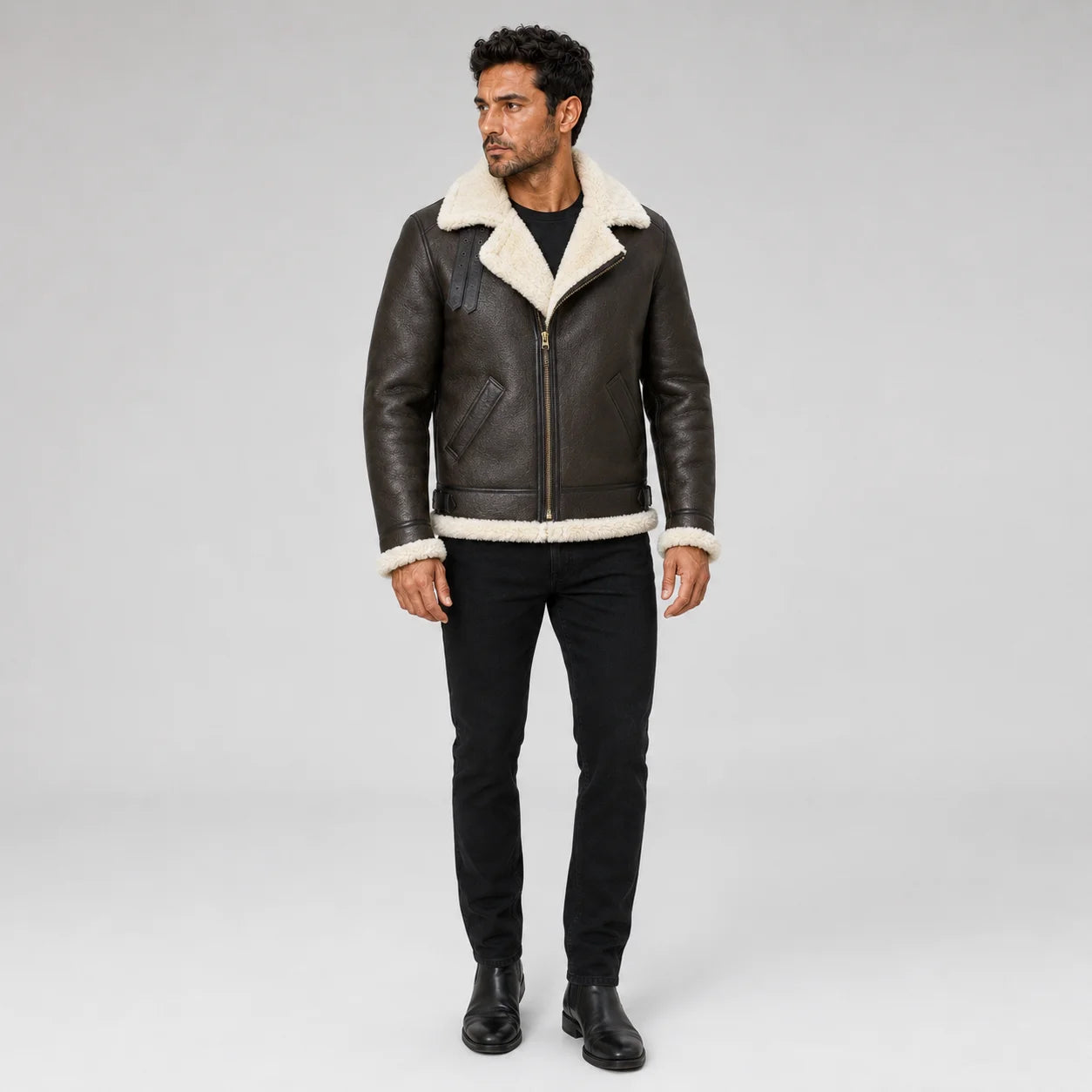 Three-quarter front view of brown B3 aviator jacket showing cream lapel-style lining, collar straps and leather texture.