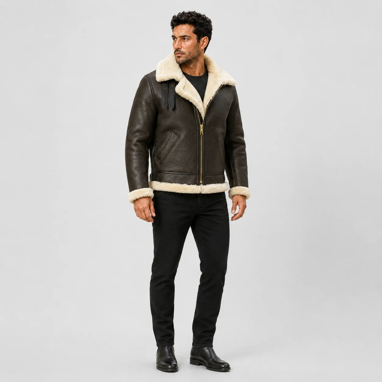 Three-quarter model view highlighting brown textured leather, cream B3 collar, angled pockets and front brass-tone zipper.