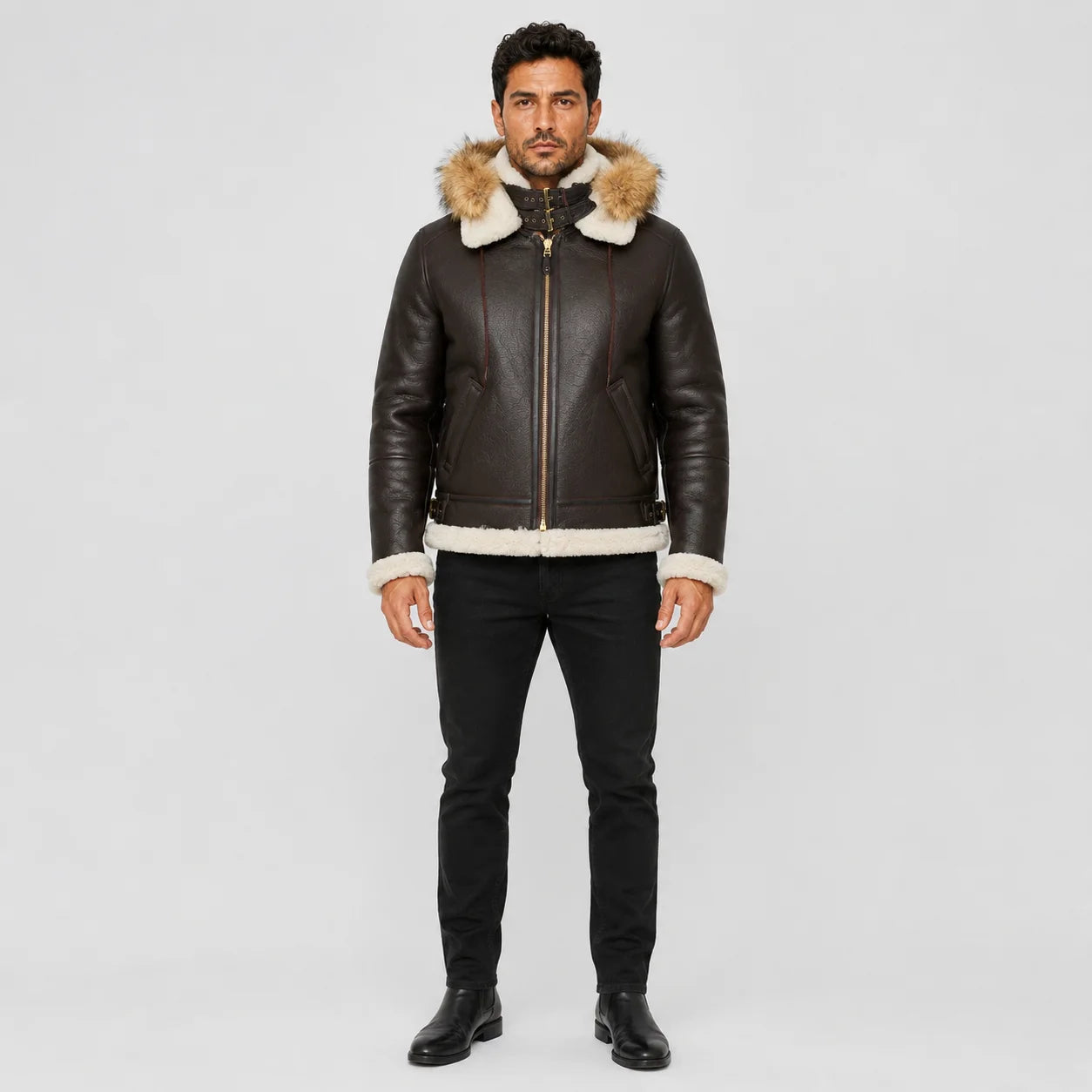 Front model view of brown B3 hooded bomber jacket with cream shearling trim, double buckle collar and zip front.