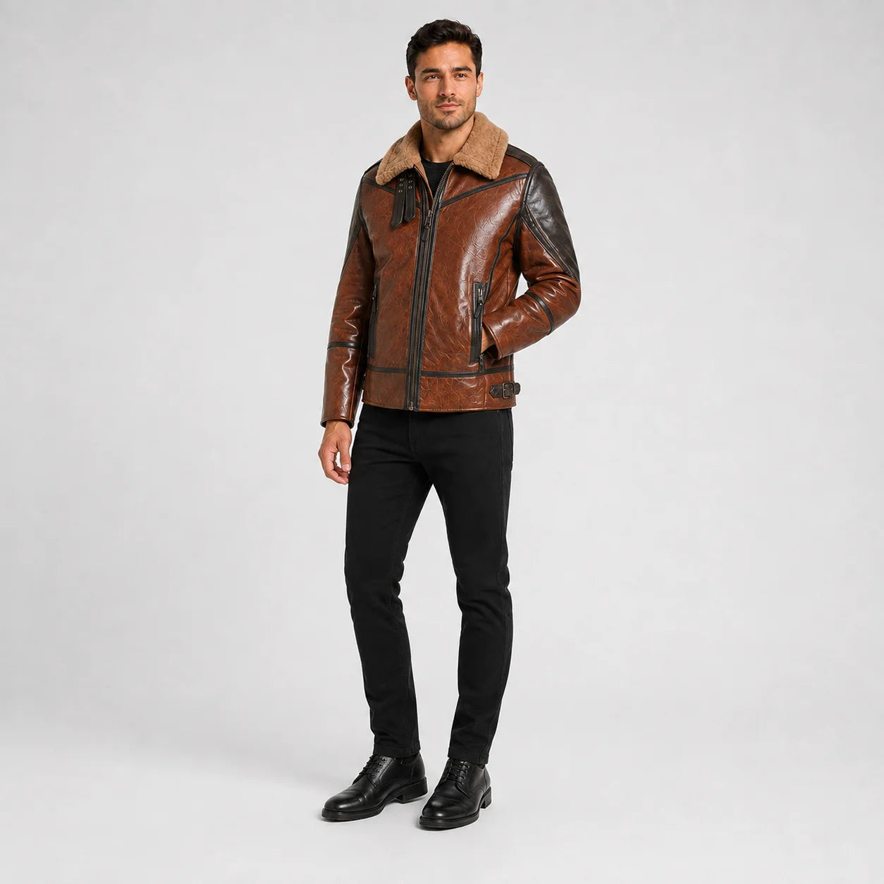 Three-quarter studio view of men’s brown leather flight jacket with tan collar, front zip and contrast sleeve detailing