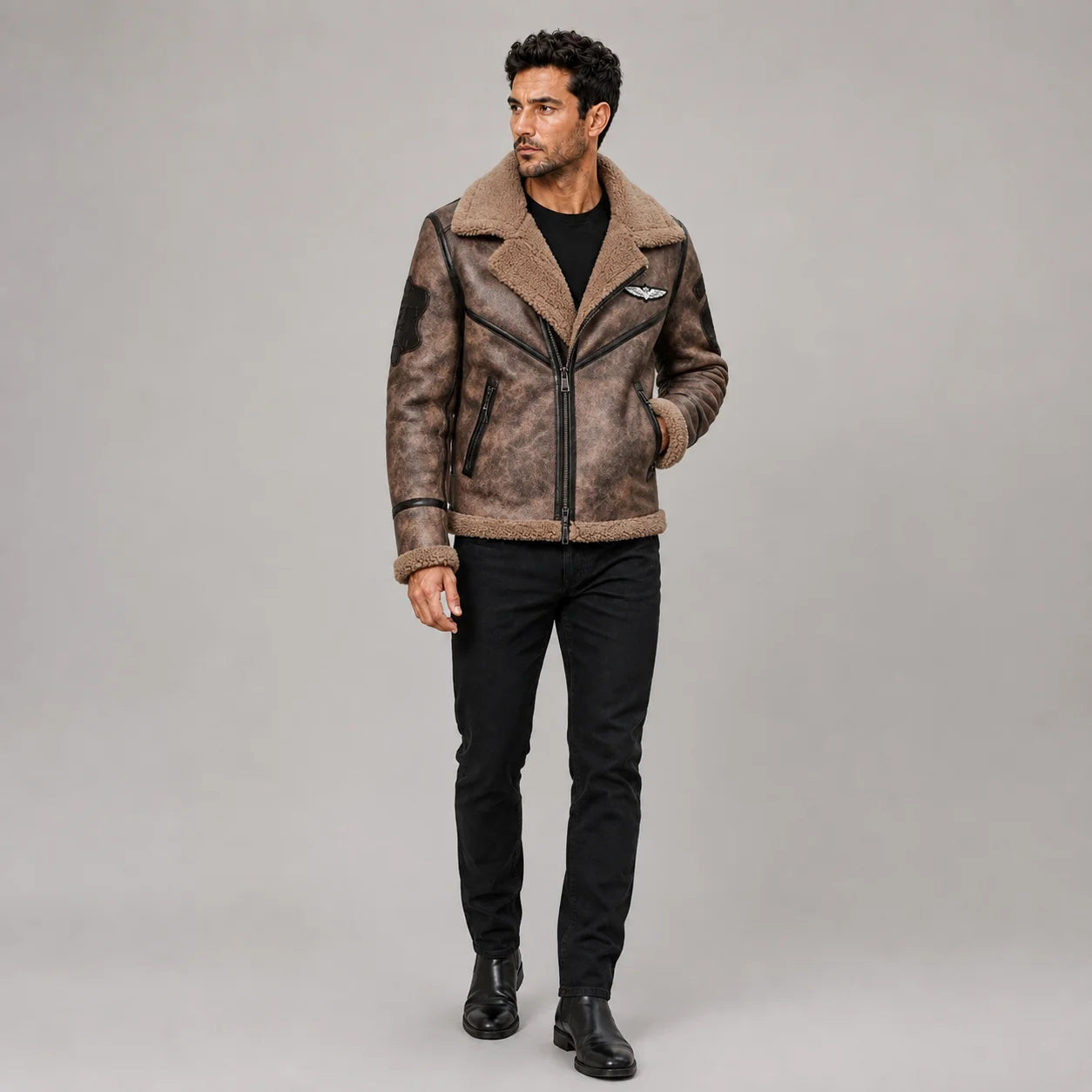 Front model view of distressed brown B3 aviator jacket with plush collar, black piping, patches and zip pockets