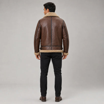 Rear studio view of brown B3 flight jacket showing cream shearling collar and hem, dark piping and waist adjustment tabs