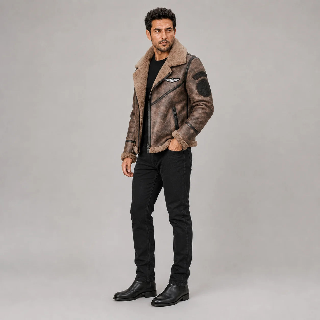 Three-quarter view of brown RAF-inspired aviator jacket with sleeve patches, chest badge and plush trim