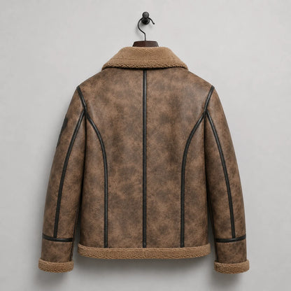Hanging rear view showing distressed brown B3 jacket with black curved piping, centre strip and plush hem