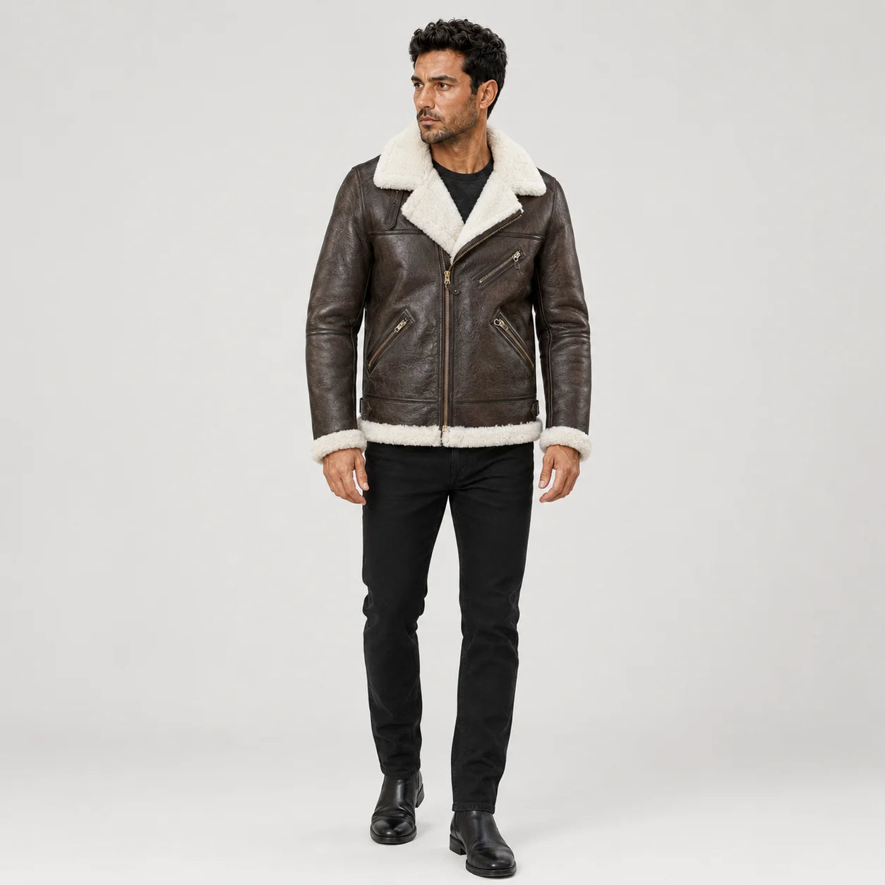 Full front model view wearing a men’s brown B3 sheepskin bomber jacket with cream collar and multiple zip pockets.