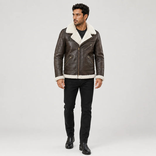 Full front model view wearing a men’s brown B3 sheepskin bomber jacket with cream collar and multiple zip pockets.