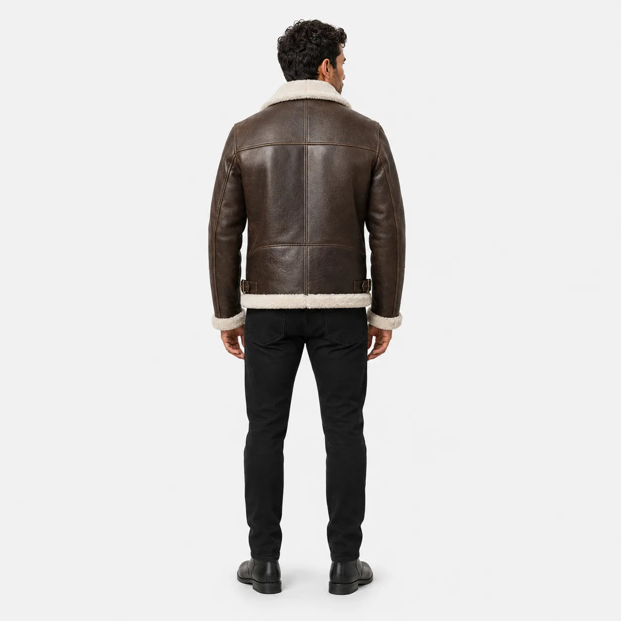 Rear model view of brown B3 aviator jacket showing cream shearling collar and hem with structured leather back panels.