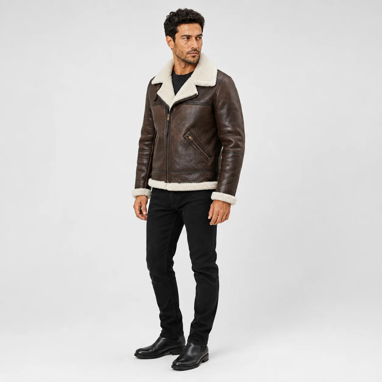 Rear model view of brown B3 aviator jacket showing cream shearling collar and hem with structured leather back panels.