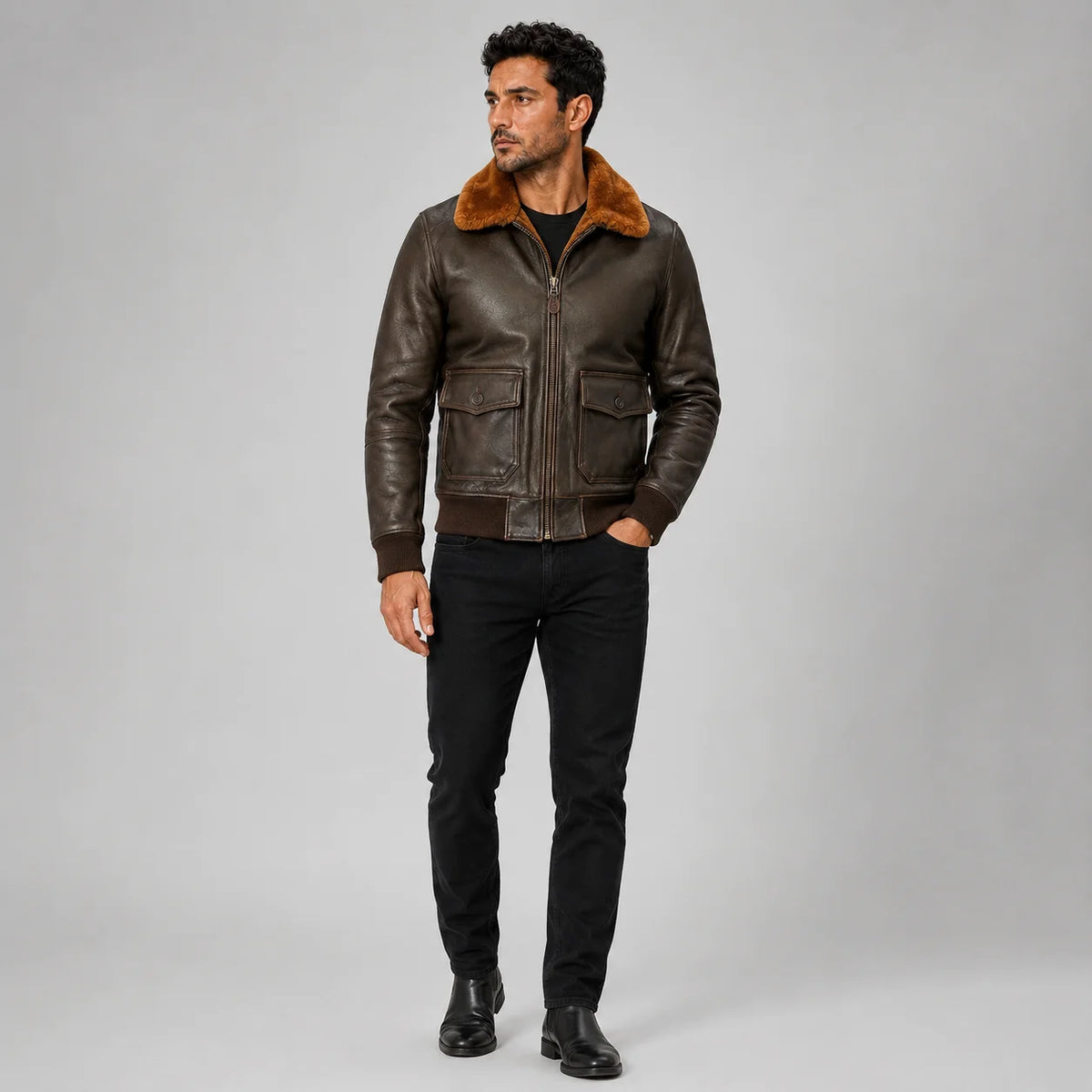 Three-quarter studio styling of brown leather flight bomber with rust plush collar, zip front and flap pockets