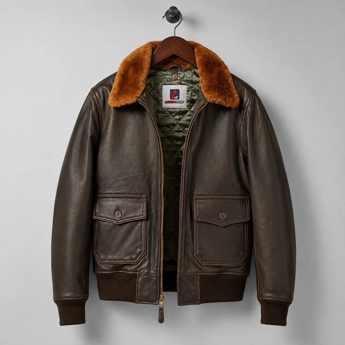 Front hanger view of brown G-1 style leather flight jacket with plush collar, quilted lining and flap pockets