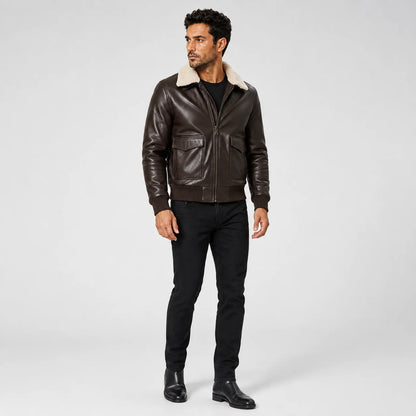 Three-quarter model view of brown lambskin bomber jacket with cream shearling collar and utility flap pockets.