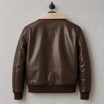 Hanging back view highlighting smooth dark brown leather panels, centre back seam and rib-knit bomber waistband.