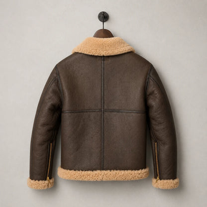 Hanging rear view of brown sheepskin RAF jacket with tan collar and hem, panelled back construction and cuff zipper details.