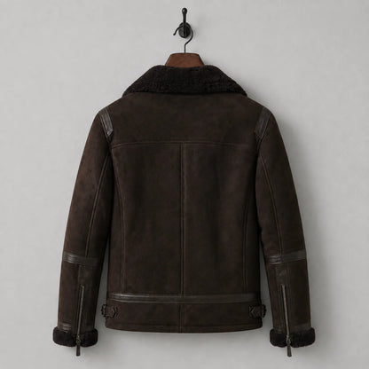 Hanging rear view of dark brown flight-style jacket with shoulder yoke, sleeve trim and adjustable waist tabs