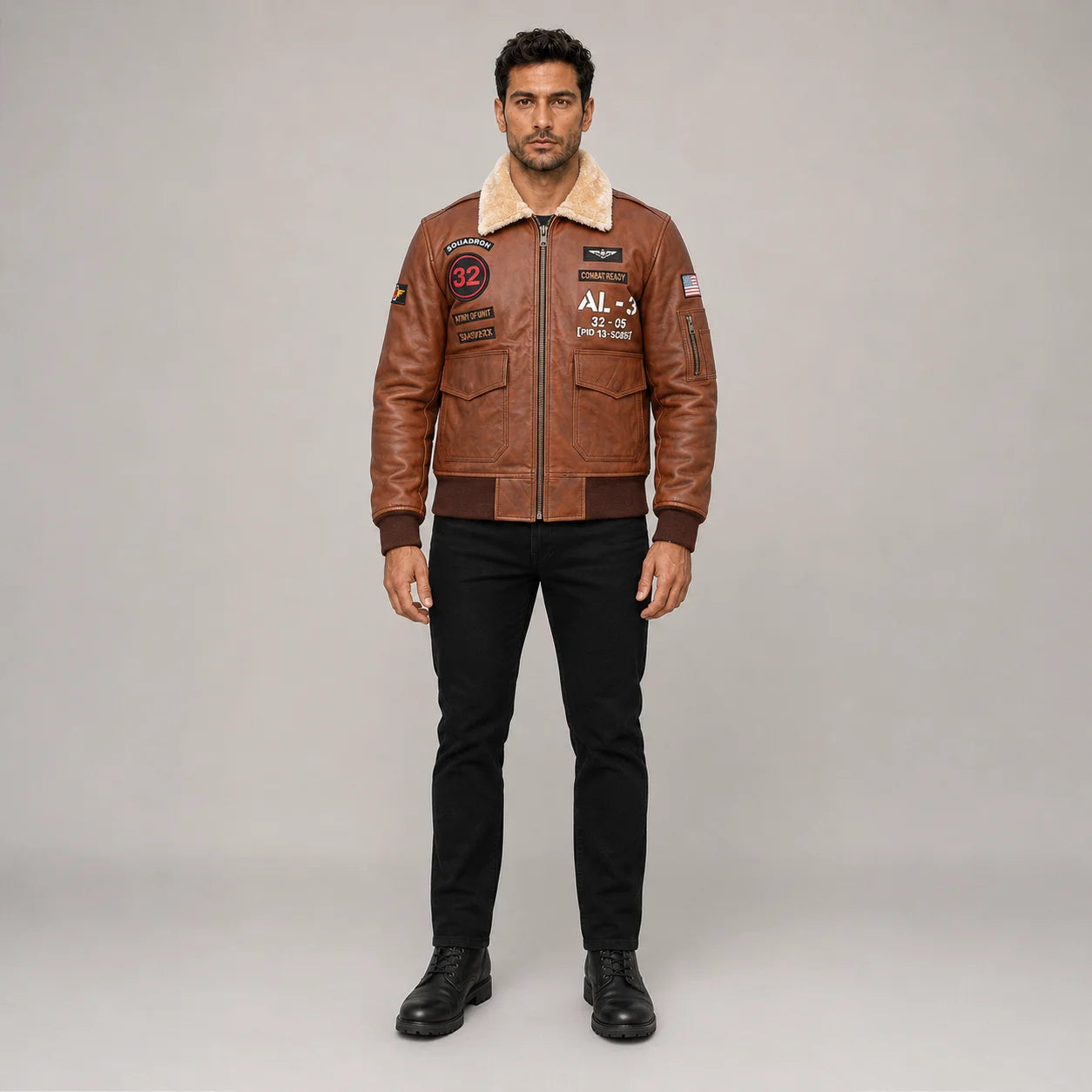 Front studio view of men’s brown aviator bomber jacket with cream collar, aviation patches, cargo pockets and ribbed hem
