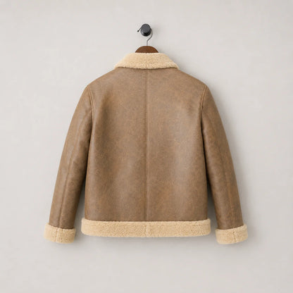 Hanging rear view of camel B3 sheepskin jacket with simple centre back seam, cream collar, cuffs and waistband trim
