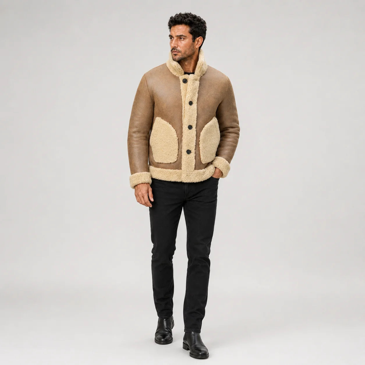 Full front model view of camel brown RAF-style sheepskin jacket with cream trim, two pockets and black trousers