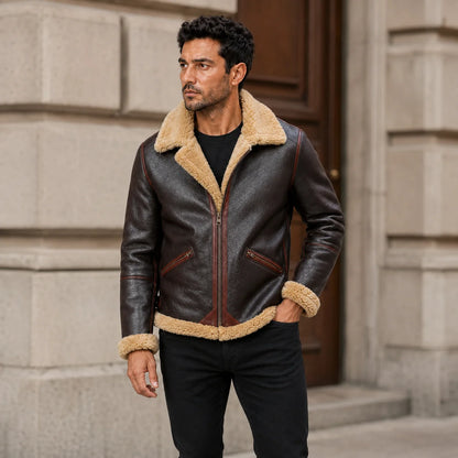 Man wearing dark brown aviator jacket with tan plush collar and zip pockets beside classic stone architecture