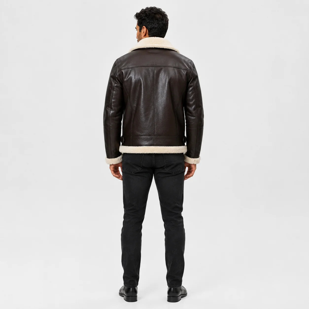 Rear studio view of men’s dark brown B3 sheepskin aviator jacket with cream collar, panelled back and waist adjusters.