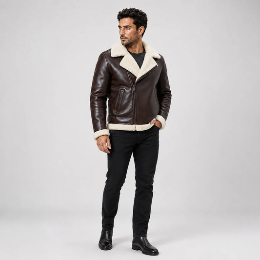 Full-length front model view wearing a dark brown B3 aviator jacket with cream shearling trim, zip front and black jeans.