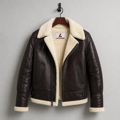 Hanging front view of dark brown B3 sheepskin aviator jacket showing cream lining, asymmetric zip and side pockets.
