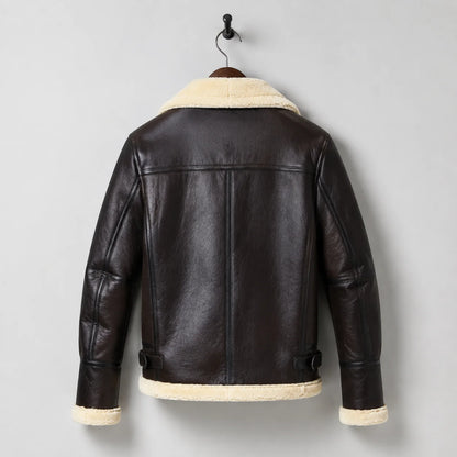 Hanging rear view of men’s brown aviator jacket with cream collar and hem trim, shoulder yoke and vertical back seams.