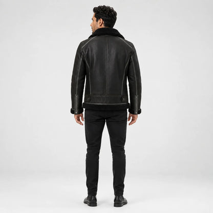 Rear model view showing dark green flight jacket with black collar and hem, panel seams and cuff zip details