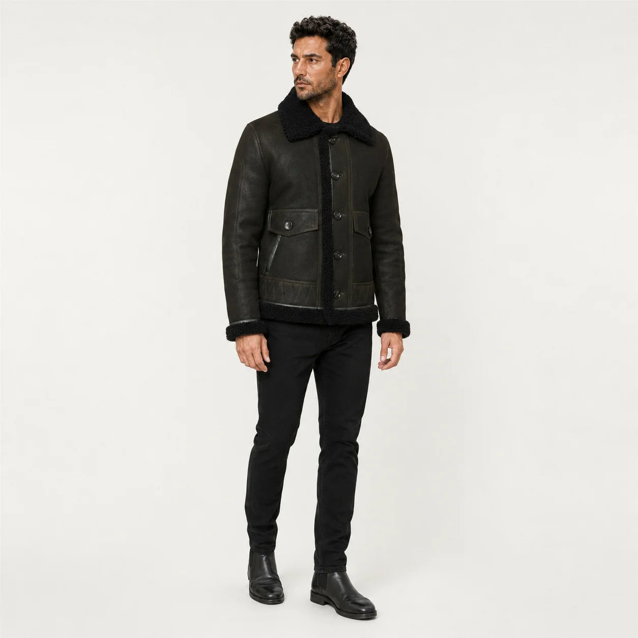 Three-quarter studio view of dark green aviator jacket highlighting button front, black collar and front pockets