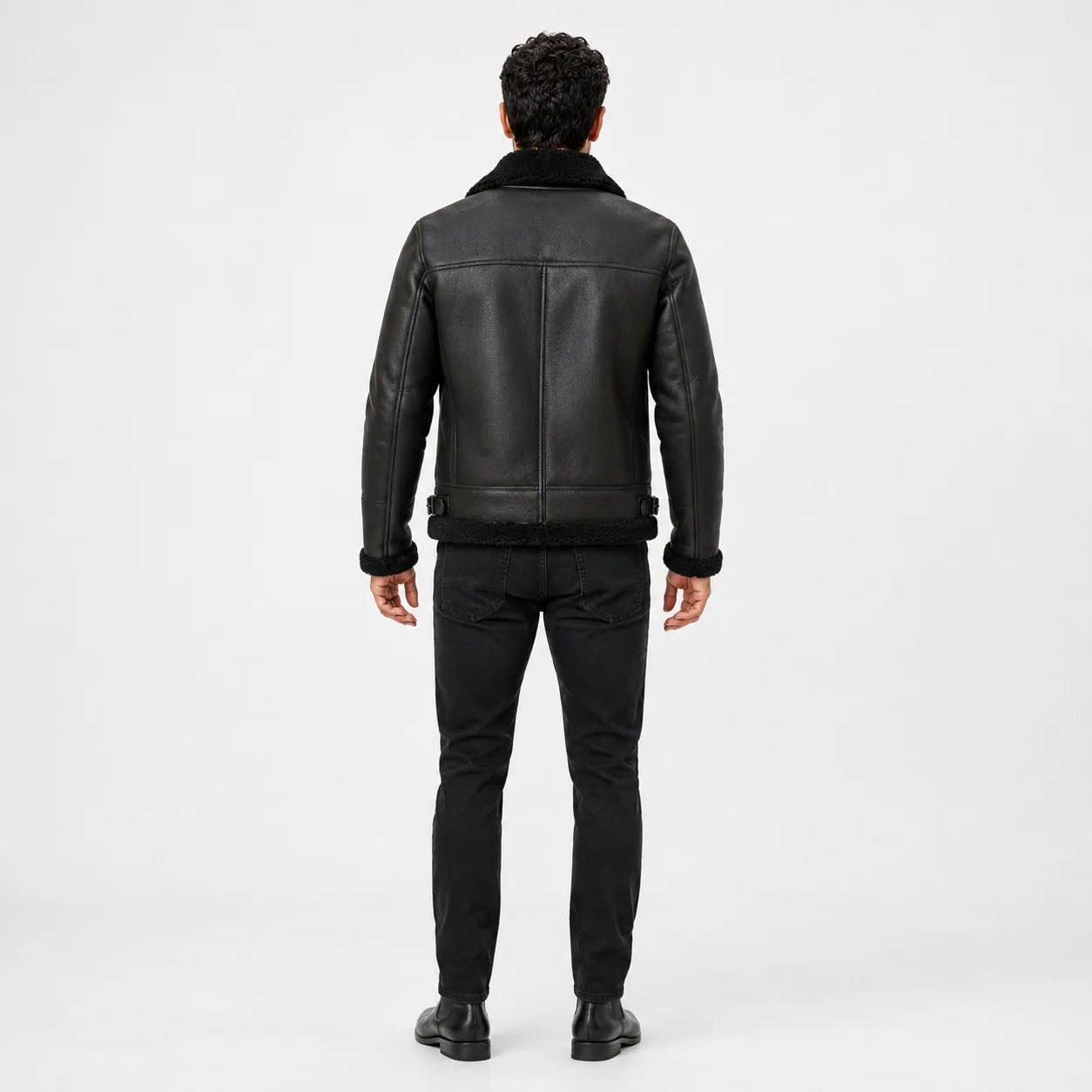 Rear studio view of dark green flight jacket showing black collar and hem trim, structured seams and waist adjusters