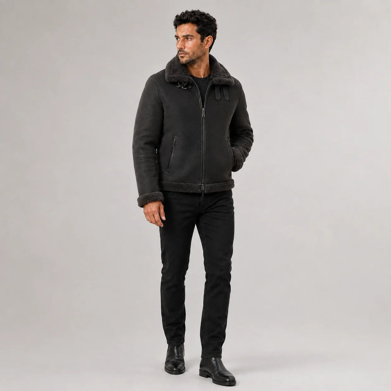 Three-quarter view of men’s grey flight jacket with plush collar, centre zipper and vertical zipped pockets