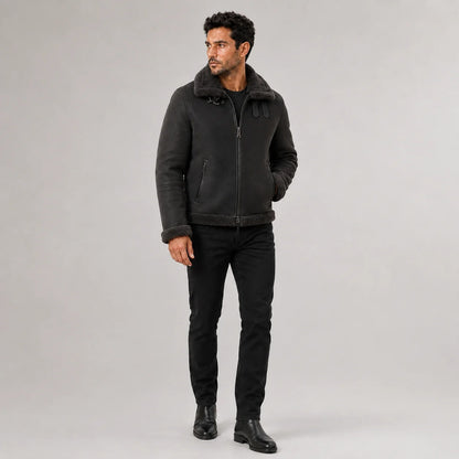 Three-quarter view of men’s grey flight jacket with plush collar, centre zipper and vertical zipped pockets